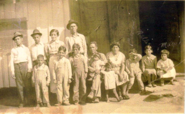 George and Susana Gomez Family 1935 Anadarko, OK at the G. R. Gomez home where they lived for 18 years on the Bert Mcvey Farm 2 3/4 East of Anadarko on Highway 9 before moving to town.  After the U. S. Army had taken 4 of his sons to war, the younger chil